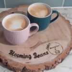 Blooming Beans mugs on a board