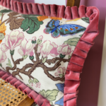 Queenie and Judge GP J Baker Magnolia Cushion Cream Blue