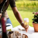 Terlingham tour table with wine and flowers