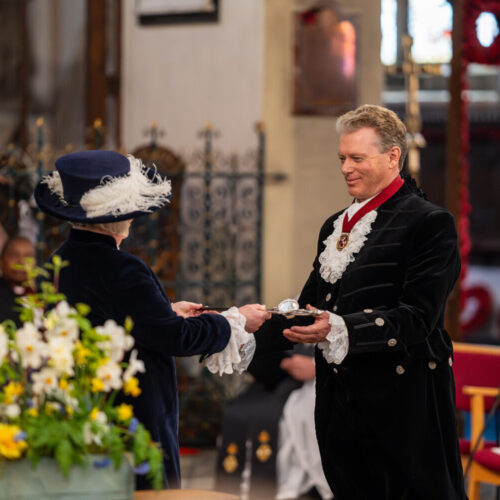 Jonathan Neame is presented with the ceremonial sword by outgoing High Sheriff of Kent Dr Gill Fargher